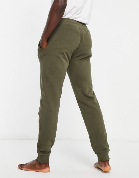 https://images.asos-media.com/products/tommy-hilfiger-loungewear-sweatpants-in-khaki-part-of-a-set/202387772-4?$n_550w$&wid=550&fit=constrain