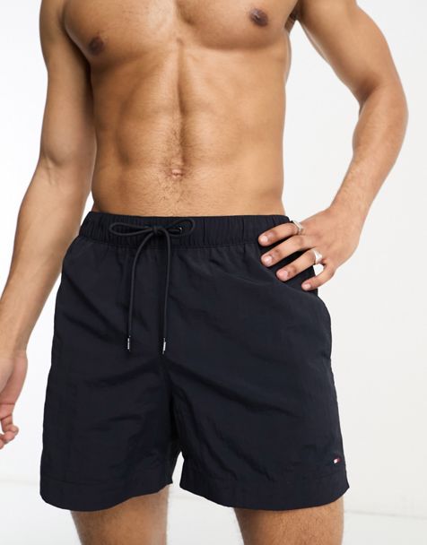 Tommy Hilfiger woven boxer shorts with all over Tommy flag print in navy, ASOS