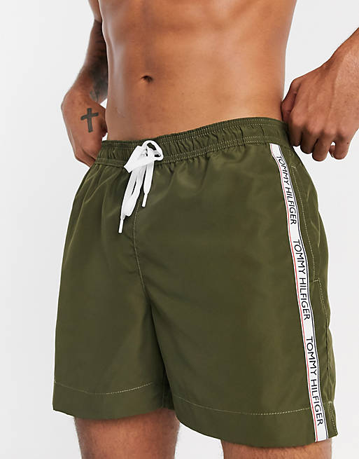 Tommy Hilfiger medium length side tape logo swim shorts in khaki | ASOS