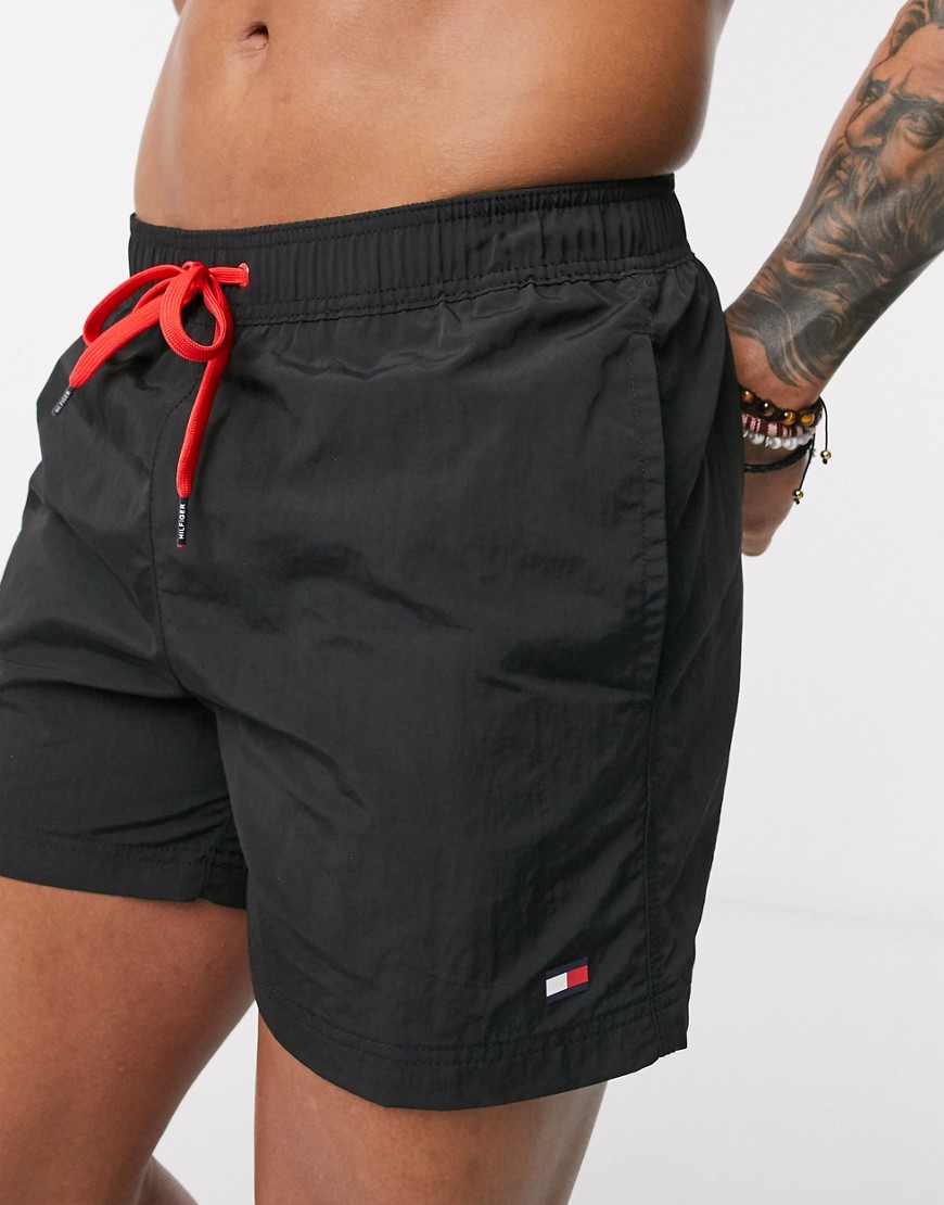 Tommy Hilfiger medium length small logo swim shorts in black