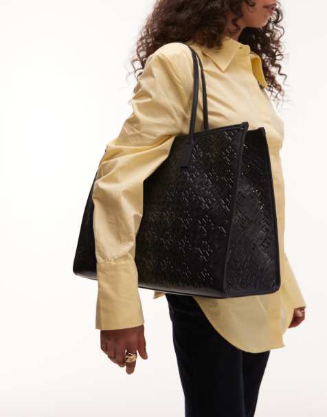 Tommy Hilfiger monogram faux leather tote bag in black - view 1