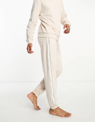 Tommy Hilfiger velour logo jogger in beige - ASOS Price Checker