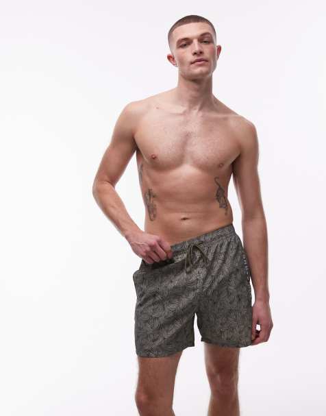 Tommy Hilfiger - Pantaloncini da bagno verdi con coulisse e stampa di foglie di palma - view 1