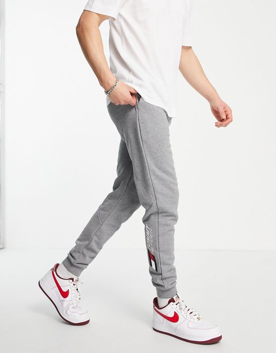 https://images.asos-media.com/products/tommy-hilfiger-performance-essentials-logo-cuffed-sweatpants-in-gray-heather/202454720-2?$n_550w$&wid=550&fit=constrain