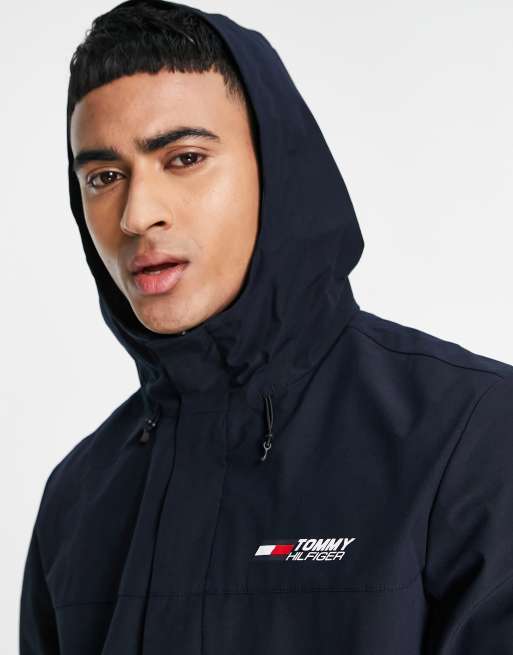 Performance logo hooded windbreaker jacket in navy | ASOS