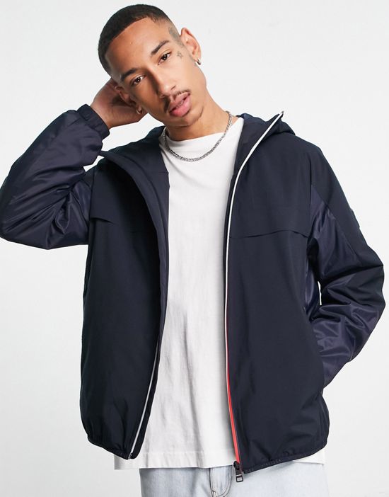https://images.asos-media.com/products/tommy-hilfiger-polyester-blend-tech-icon-stripe-zip-hooded-jacket-in-navy-navy/202706333-1-navy?$n_550w$&wid=550&fit=constrain