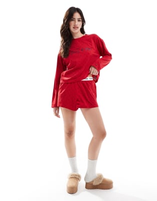 Tommy Hilfiger - Pyjama aus T-Shirt und Shorts in Rot mit Retroprint