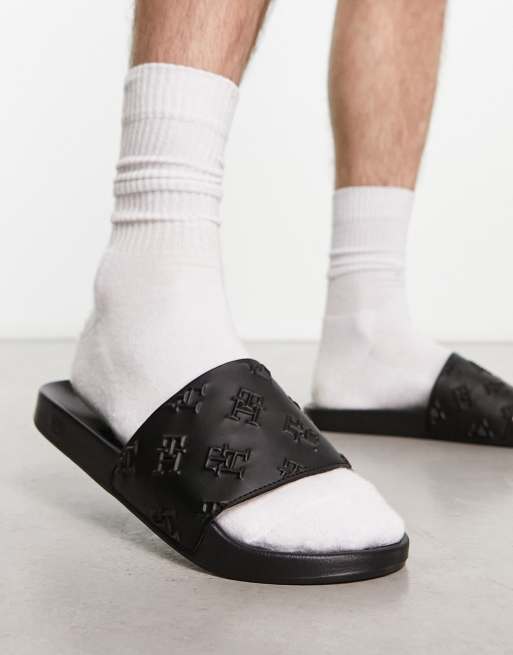 Tommy Hilfiger – Slider in Schwarz mit Monogramm-Prägung