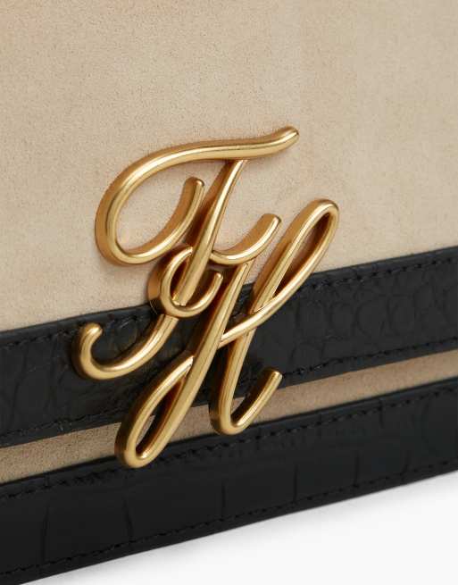Tommy Hilfiger Suede metal logo crossbody bag in black/white, 4 of 5