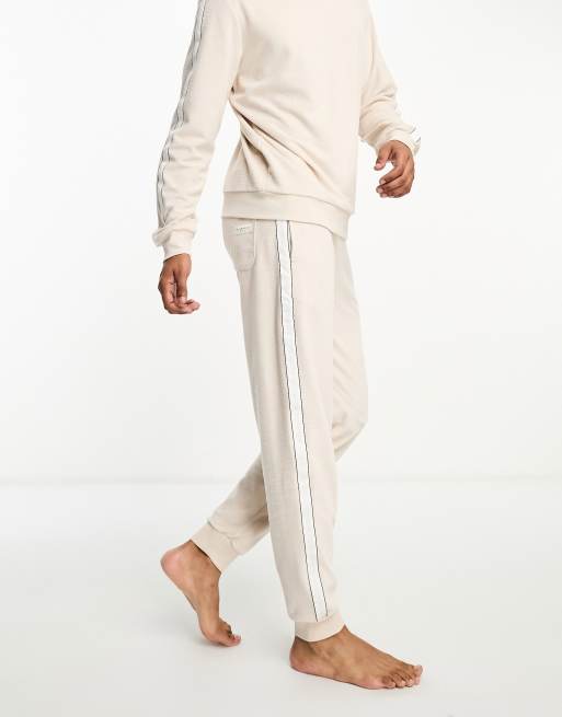 https://images.asos-media.com/products/tommy-hilfiger-velour-logo-sweatpants-in-beige/205120855-1-beige?$n_640w$&wid=513&fit=constrain