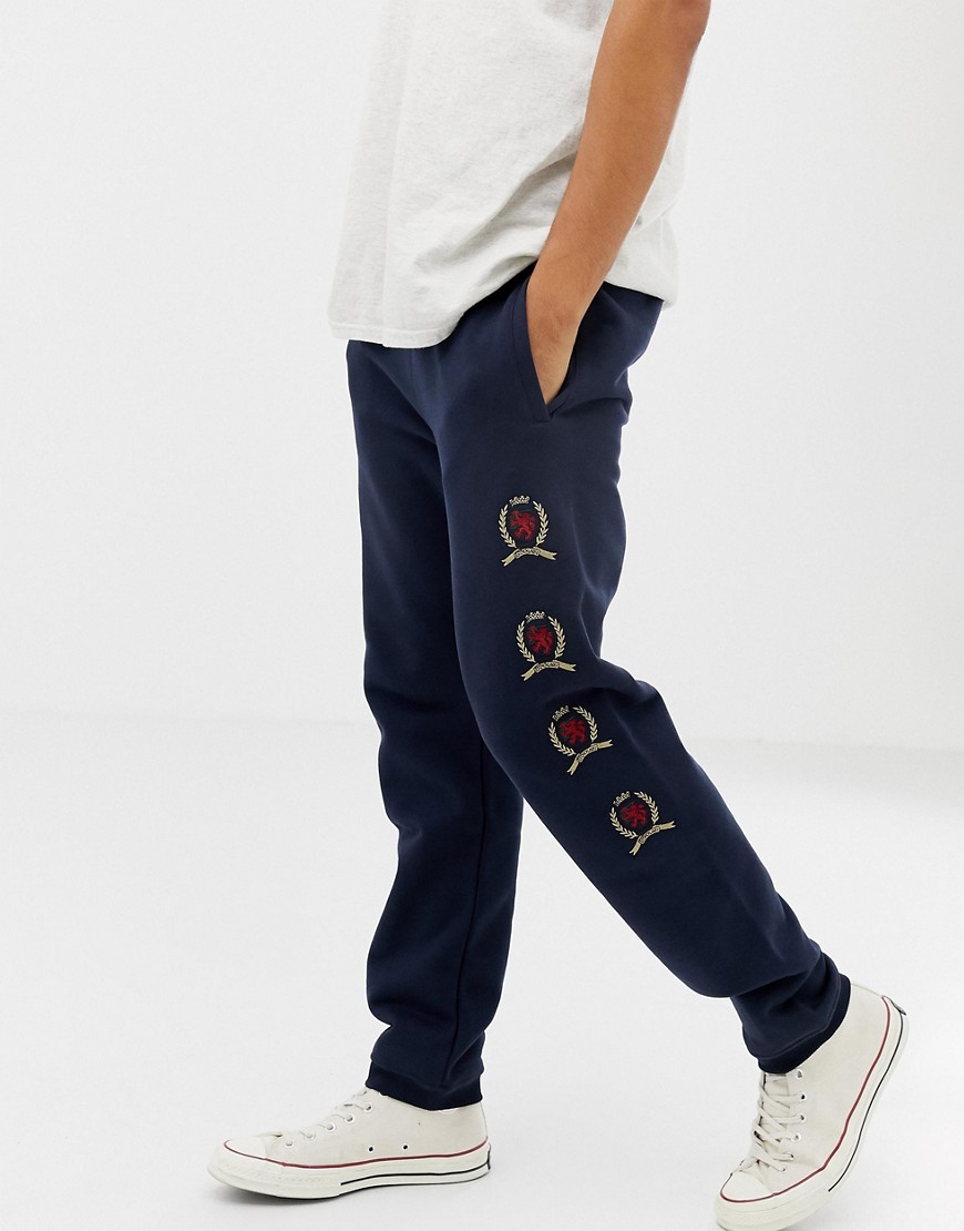 Tommy Jeans - 6.0 Limited Capsule - Joggers blu navy con logo a stemma ripetuto
