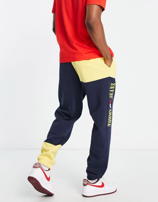 https://images.asos-media.com/products/tommy-jeans-acid-capsule-cotton-blend-color-block-sweatpants-in-blue-yellow-navy/202649165-4?$n_550w$&wid=550&fit=constrain