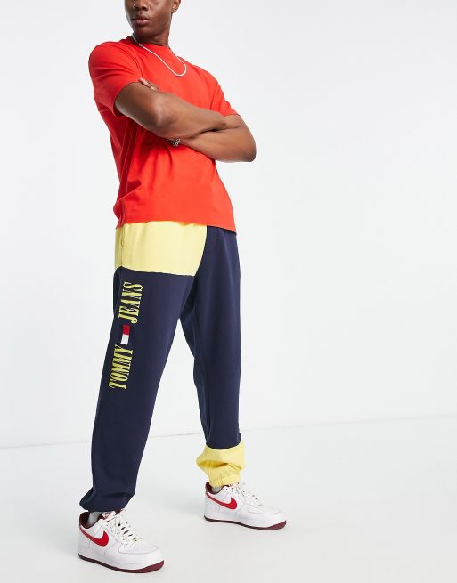 Tommy Jeans - Acid capsule - Joggers in misto cotone color block blu/ gialli - NAVY