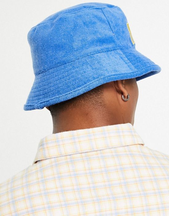 https://images.asos-media.com/products/tommy-jeans-acid-towelling-bucket-hat-in-blue/202956321-2?$n_550w$&wid=550&fit=constrain