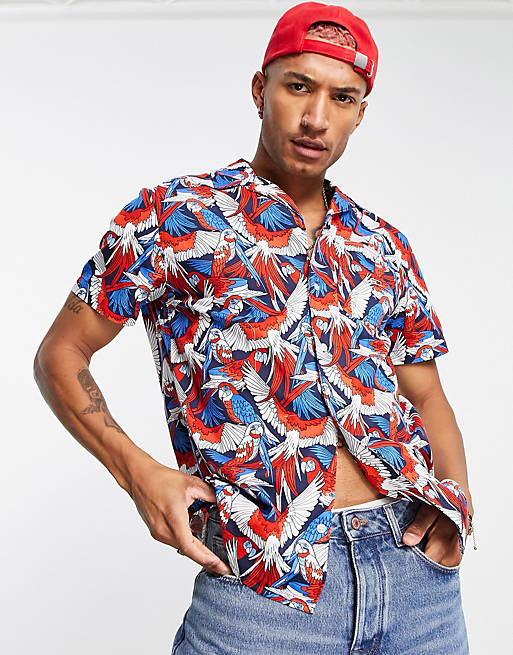 Tommy Jeans all over parrot print short sleeve camp shirt in red