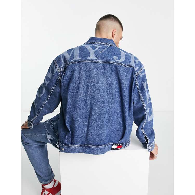 Tommy Jeans arm logo oversized denim trucker jacket in mid wash ASOS