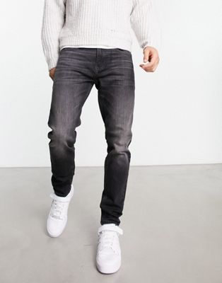 Tommy Jeans Austin slim tapered fit jeans in washed black - ASOS Price Checker