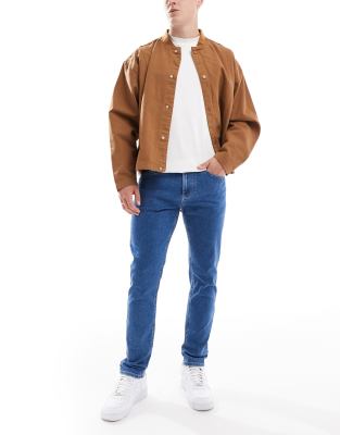 Tommy Jeans Austin slim tapered jeans in mid wash-Blue