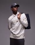 [Tommy Jeans] Tommy Jeans badge rugby shirt in off white stripe XS Newsprint