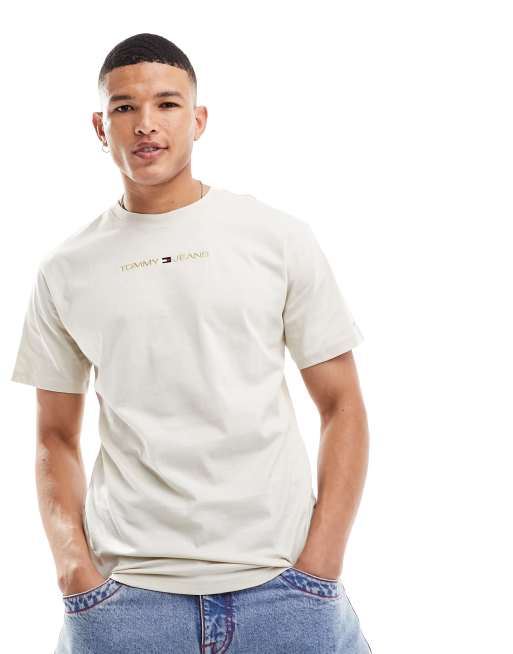 Tommy Jeans - Beige klassisk T-shirt i sort med guldfarvet lineært logo