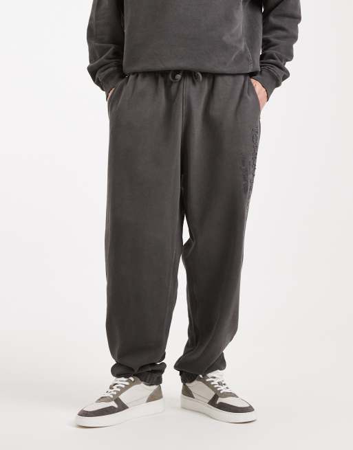 Tommy Jeans – Bleksvarta, avslappnade mjukisbyxor med logga, 2 av 5
