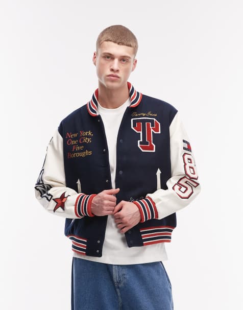 Tommy Jeans - Chaqueta universitaria azul marino con parche gráfico del logo y mangas de cuero - view 1