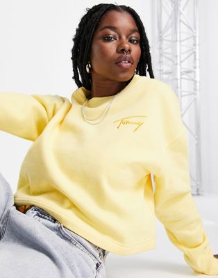 Tommy Jeans cropped signature logo crew neck sweater in yellow