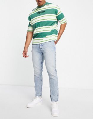 Tommy Jeans dad regular tapered fit jeans in light wash - ASOS Price Checker