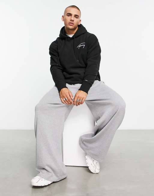 Tommy Jeans - Felpa con cappuccio comoda in pile nera con firma del logo , 4 di 4