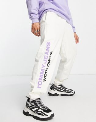 Tommy Jeans global unites logo cuffed joggers in off white