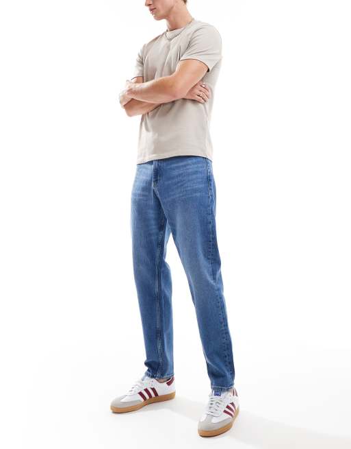 Tommy Jeans - Isaac - Mellemvaskede, afslappede og tapered jeans