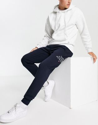 Tommy Jeans trackies in navy with text print - ASOS Price Checker