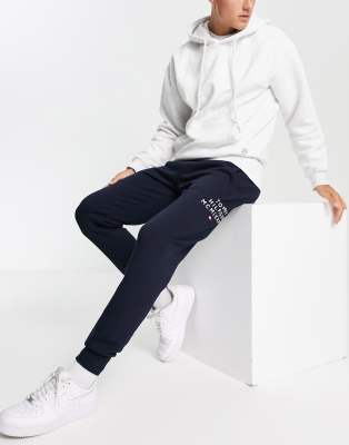 Tommy Jeans trackies in navy with text print - ASOS Price Checker