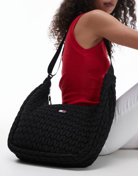 Tommy Jeans large quilted body bag in black - view 1