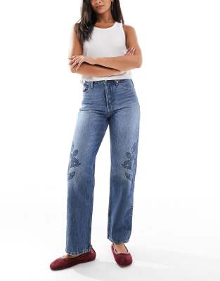 Tommy Jeans - Layla - Gerade geschnittene Straight Jeans in dunkler Waschung mit hohem Bund und Blumenprint-Marineblau