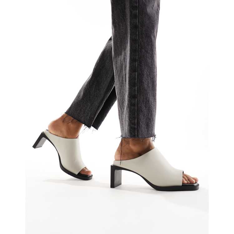 Grey store heeled mules