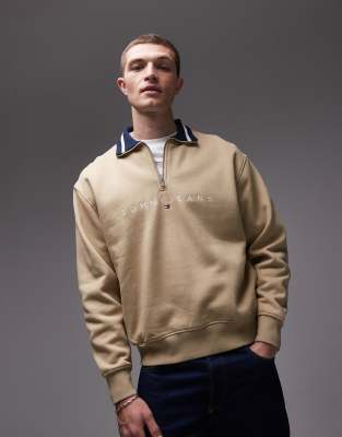 Tommy Jeans linear logo half zip sweatshirt in beige-Brown