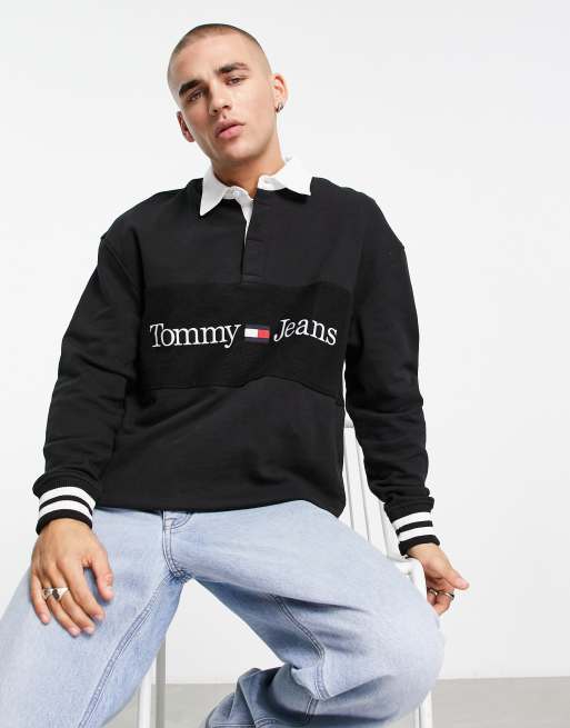 Tommy Jeans linear logo relaxed fit rugby polo in black | ASOS