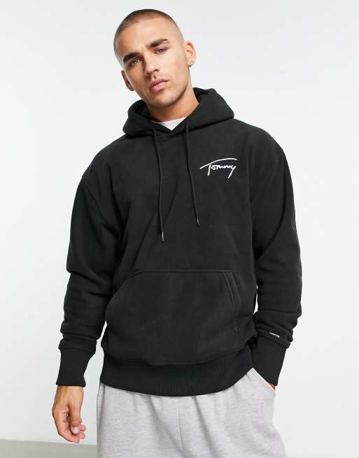 Tommy Jeans – Locker geschnittener Kapuzenpullover aus Polar-Fleece in Schwarz mit Markenlogo 