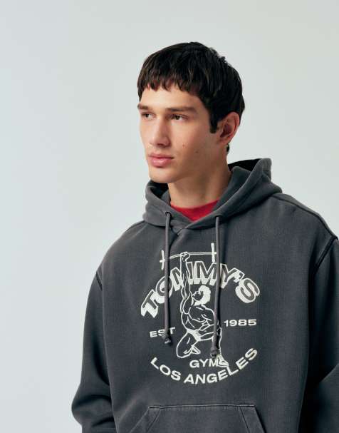 Tommy Jeans – Locker geschnittener Sport-Kapuzenpullover in verwaschenem Schwarz mit Logo - view 1