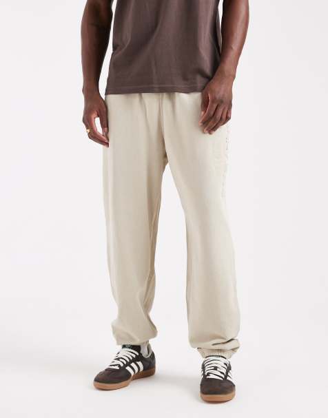 Tommy Jeans logo relaxed joggers in sand - view 1