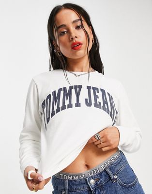 Tommy Jeans cotton relaxed cropped collegiate logo long sleeve t-shirt in white - WHITE