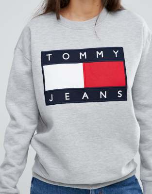 white sweatshirt with red and blue stripe