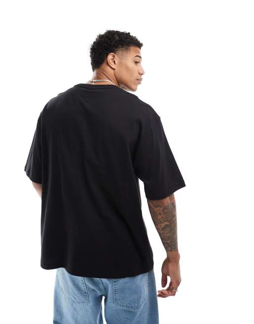Tommy Jeans oversized crest varsity sports T-shirt in black