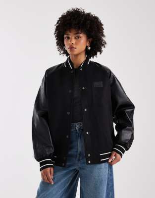 Tommy Jeans Oversized Flag Logo Varsity Jacket In Black