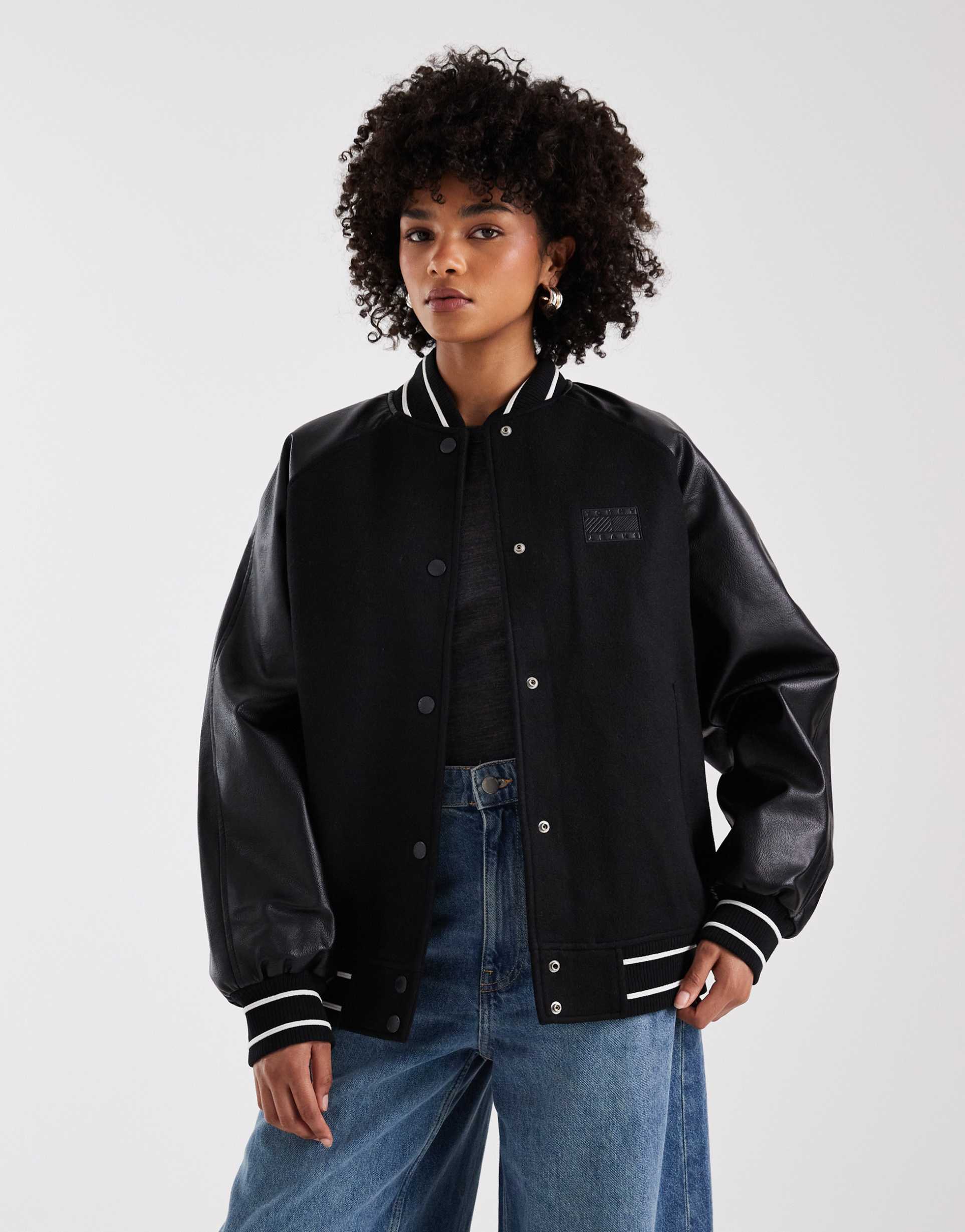 tommy jeans oversized flag logo varsity jacket in black