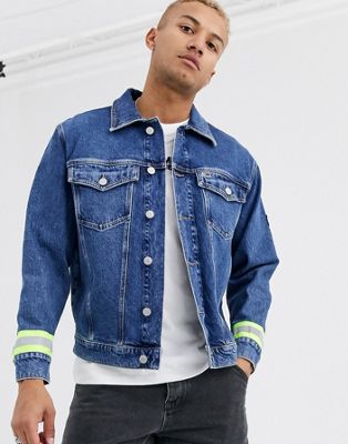 Tommy Jeans oversized reflective denim trucker jacket in mid blue