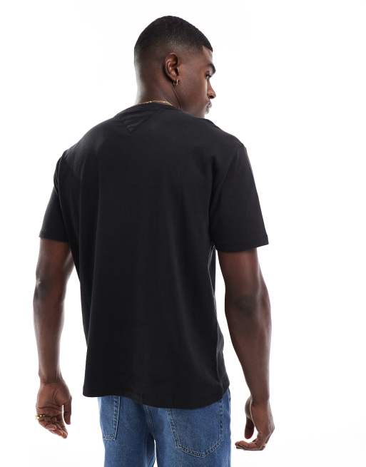 Tommy Jeans regular badge logo T-shirt in black | ASOS