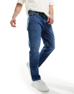 Shop Tommy Jeans Regular Tapered Dad Jeans In Mid Wash-navy