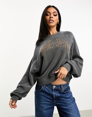 Tommy Jeans relaxed leopard print logo crewneck sweatshirt in charcoal | ASOS
